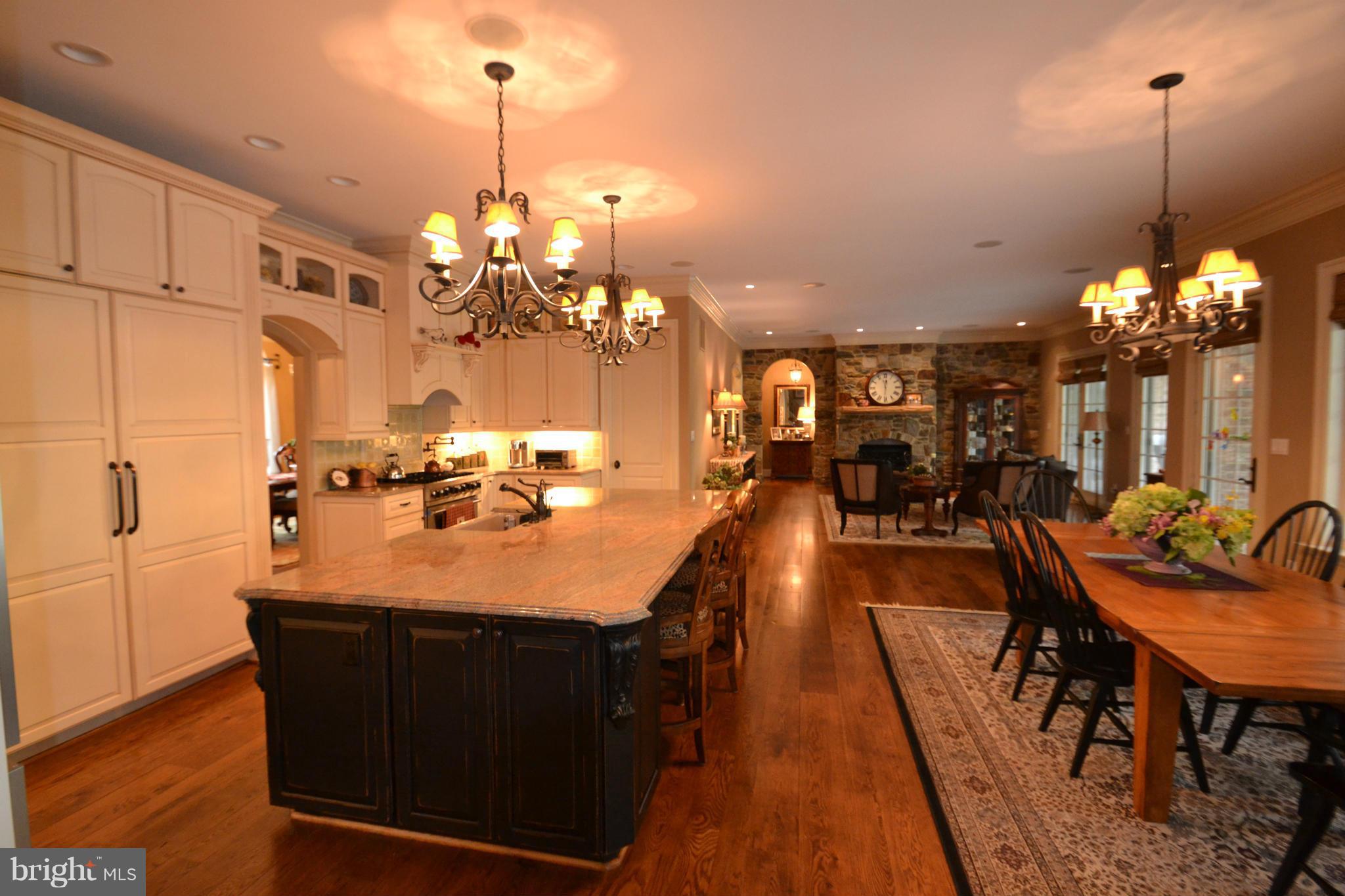1827 Ridge Road Reisterstown, MD 21136 - Photo 11 of 30 a dining table with chairs and a chandelier