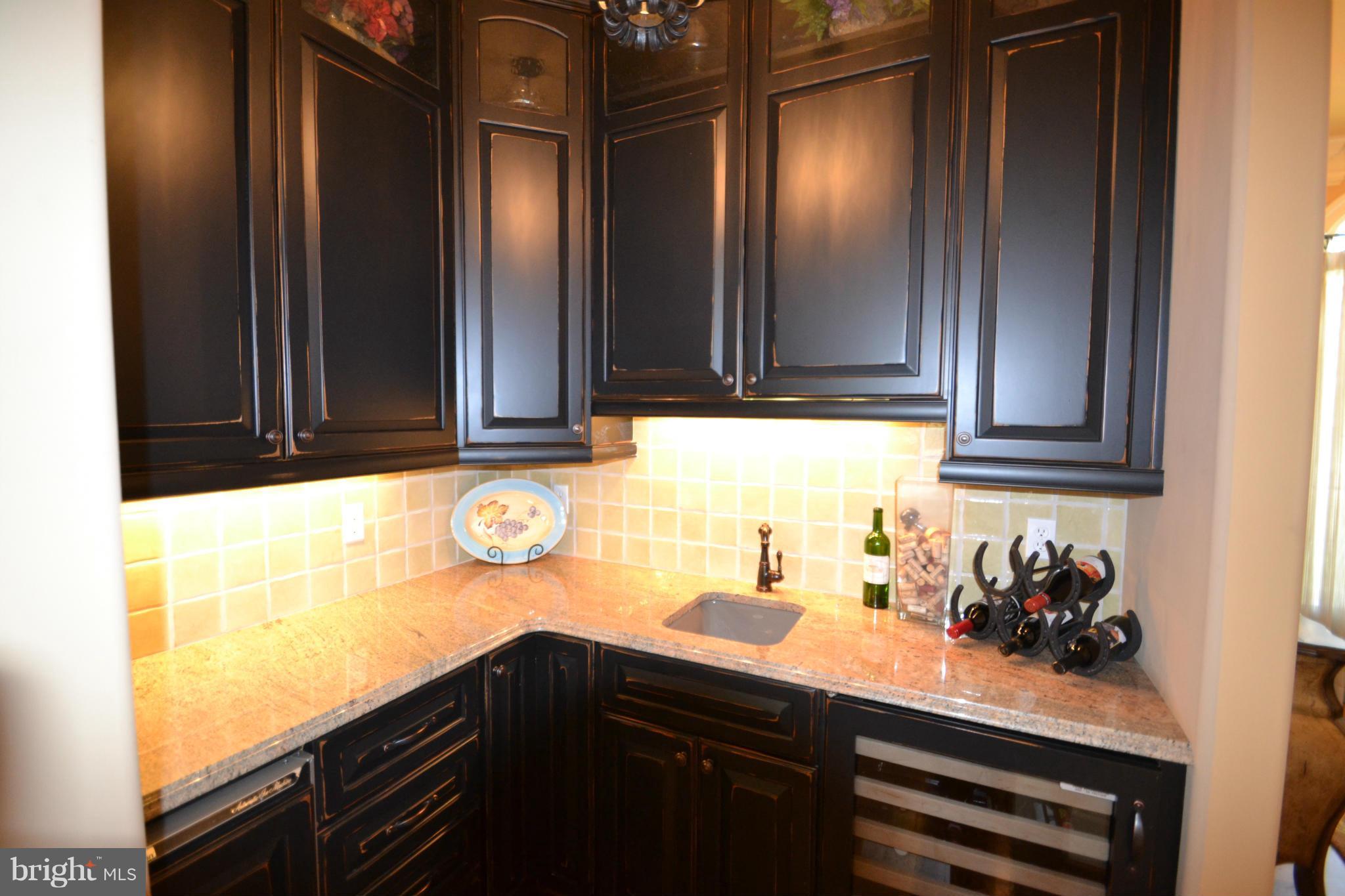 1827 Ridge Road Reisterstown, MD 21136 - Photo 12 of 30 a kitchen with a refrigerator and a stove top oven