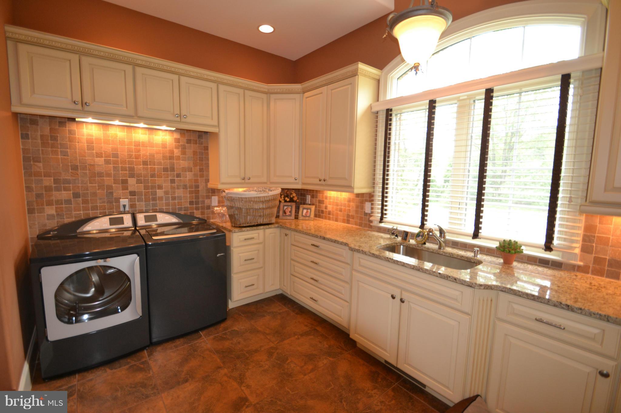 1827 Ridge Road Reisterstown, MD 21136 - Photo 13 of 30 a kitchen with a sink stove and cabinets