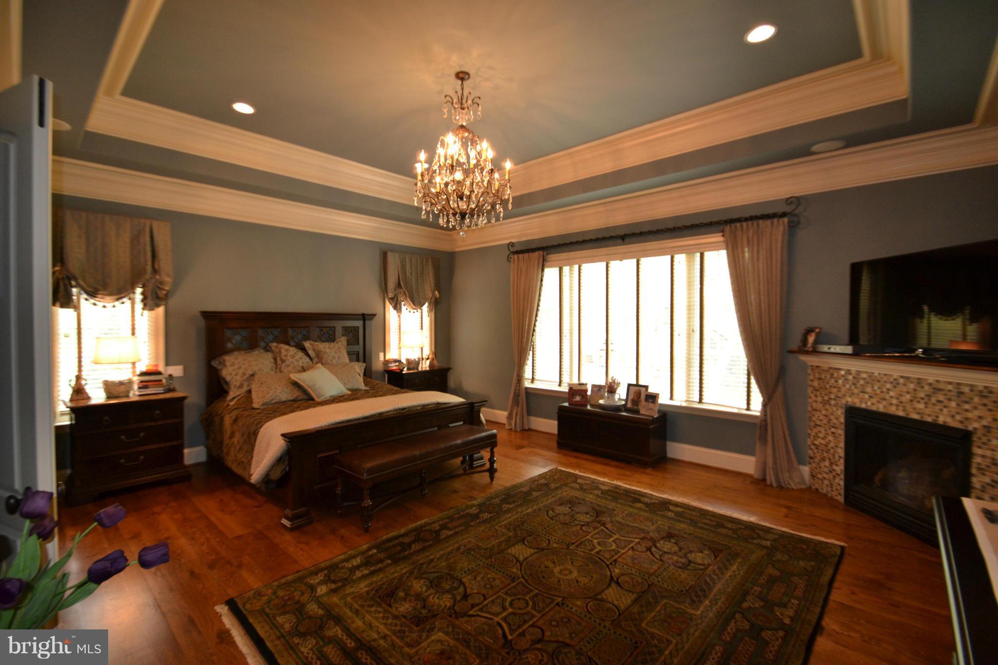 1827 Ridge Road Reisterstown, MD 21136 - Photo 15 of 30 a spacious bedroom with a bed and a chandelier