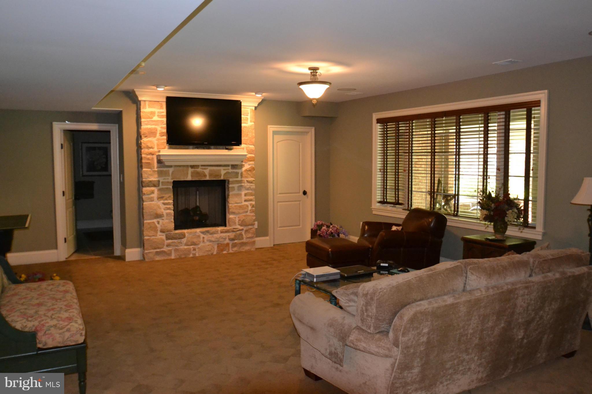 1827 Ridge Road Reisterstown, MD 21136 - Photo 21 of 30 a living room with furniture and a flat screen tv