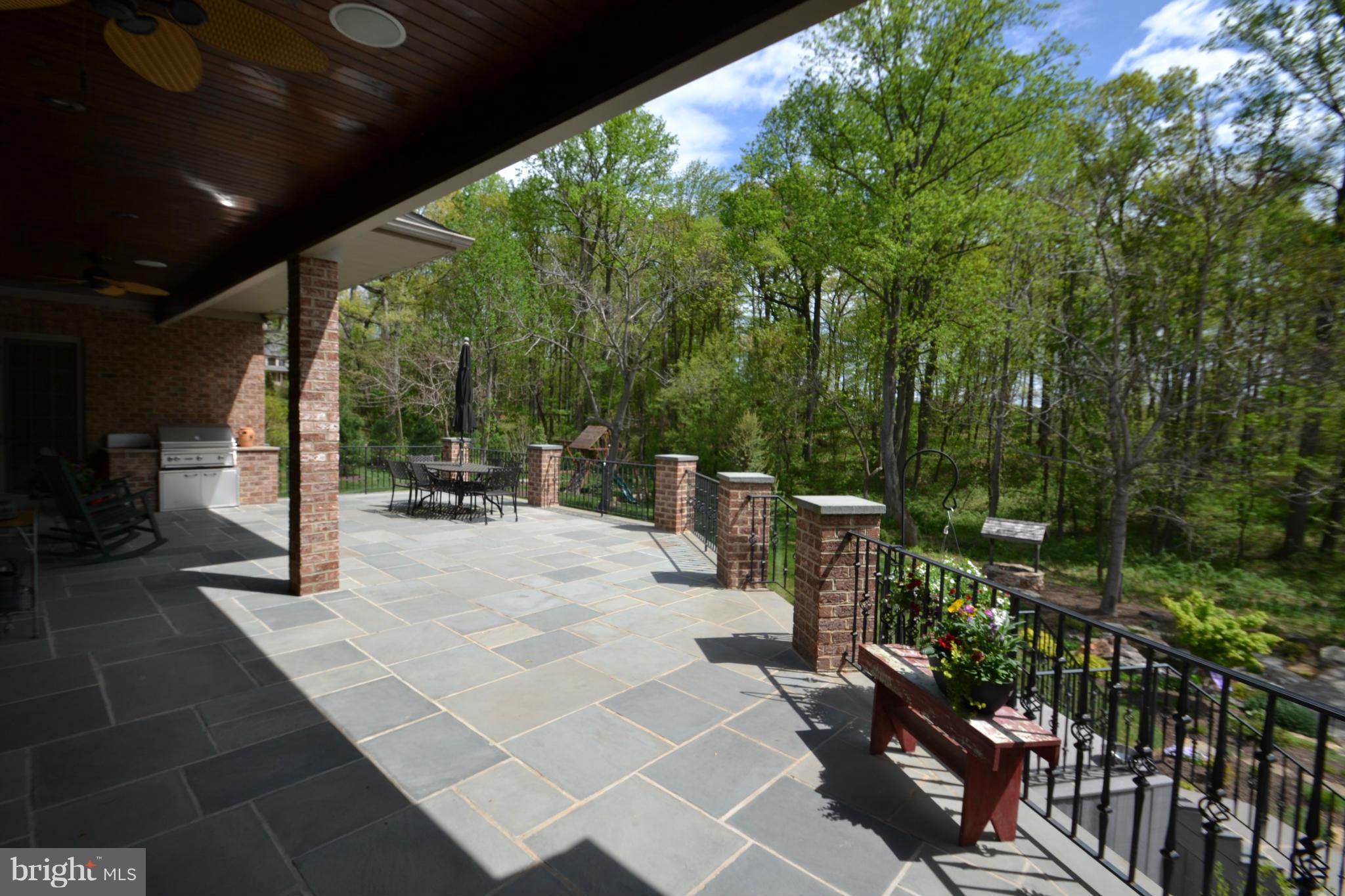 1827 Ridge Road Reisterstown, MD 21136 - Photo 25 of 30 a view of a patio with a table and chairs with wooden floor and fence