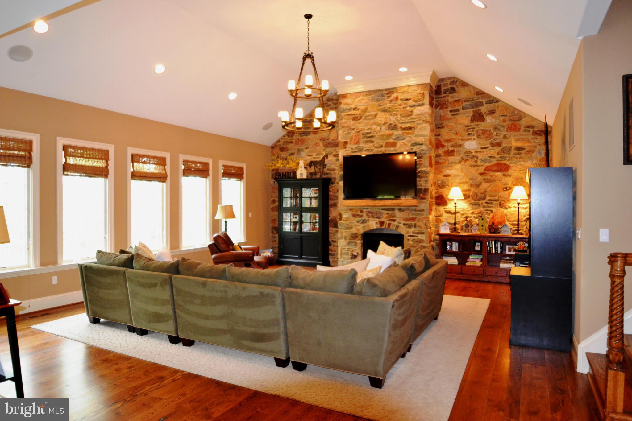 1827 Ridge Road Reisterstown, MD 21136 - Photo 7 of 30 a living room with fireplace furniture and a flat screen tv