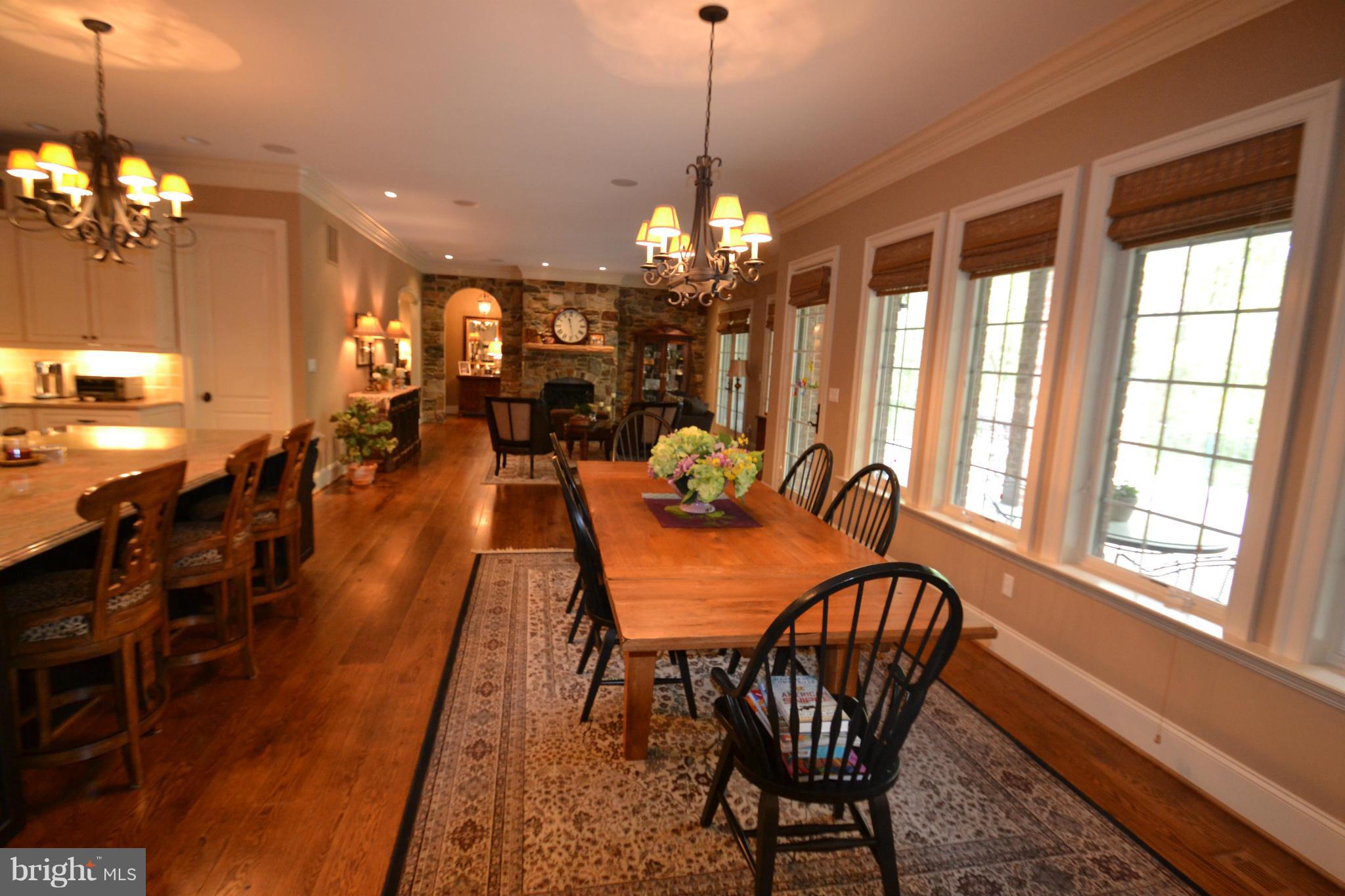 1827 Ridge Road Reisterstown, MD 21136 - Photo 9 of 30 a dining room with furniture a chandelier and wooden floor