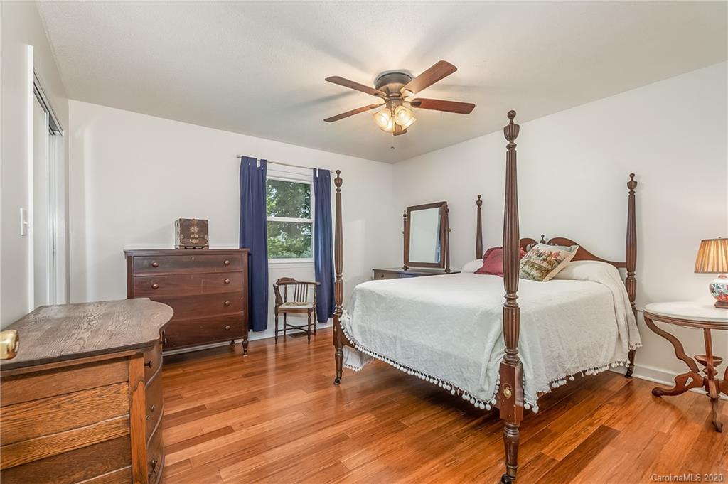 1914 Coxe Road Rutherfordton, NC 28139 - Photo 17 of 47 a bedroom with a bed and wooden floor