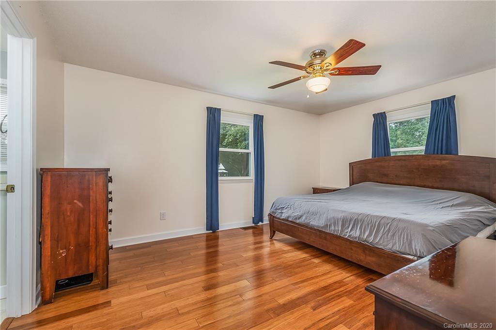 1914 Coxe Road Rutherfordton, NC 28139 - Photo 19 of 47 a bedroom with two beds and a ceiling fan