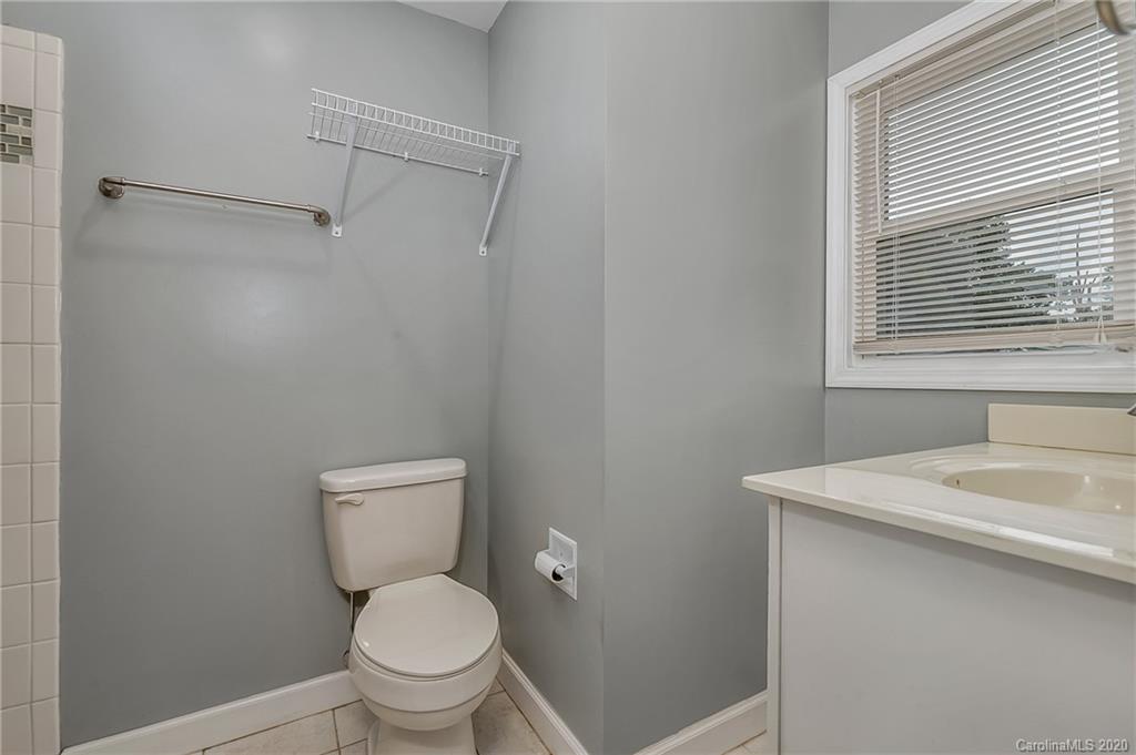 1914 Coxe Road Rutherfordton, NC 28139 - Photo 21 of 47 a white toilet sitting next to a bathroom sink