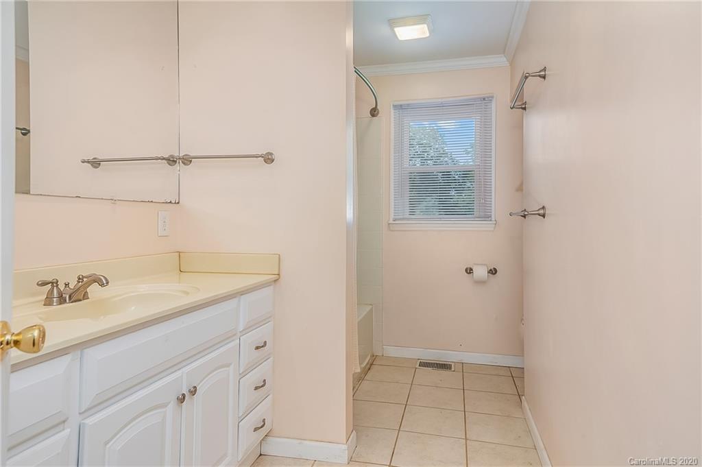 1914 Coxe Road Rutherfordton, NC 28139 - Photo 24 of 47 a bathroom with a sink and a mirror