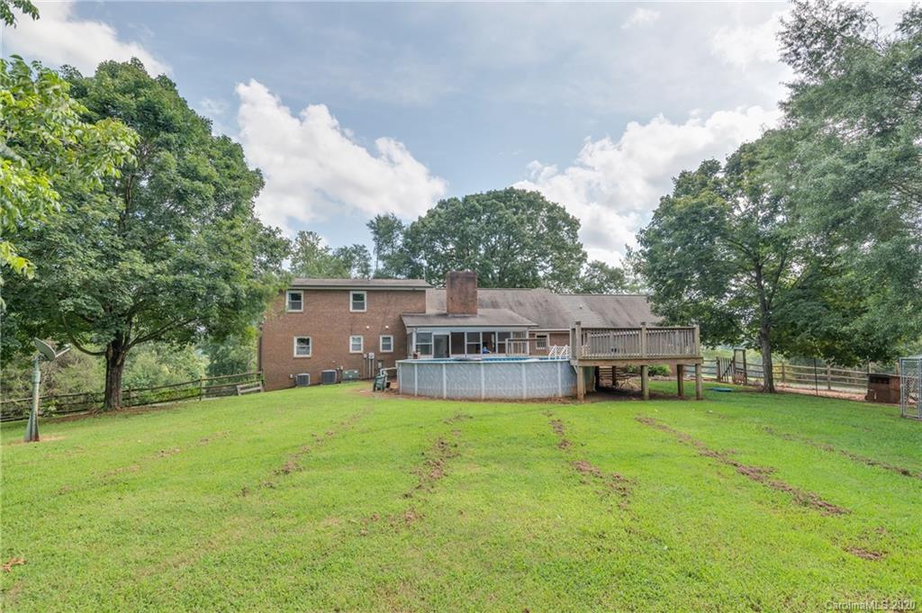 1914 Coxe Road Rutherfordton, NC 28139 - Photo 42 of 47 a view of a house with a big yard and large trees