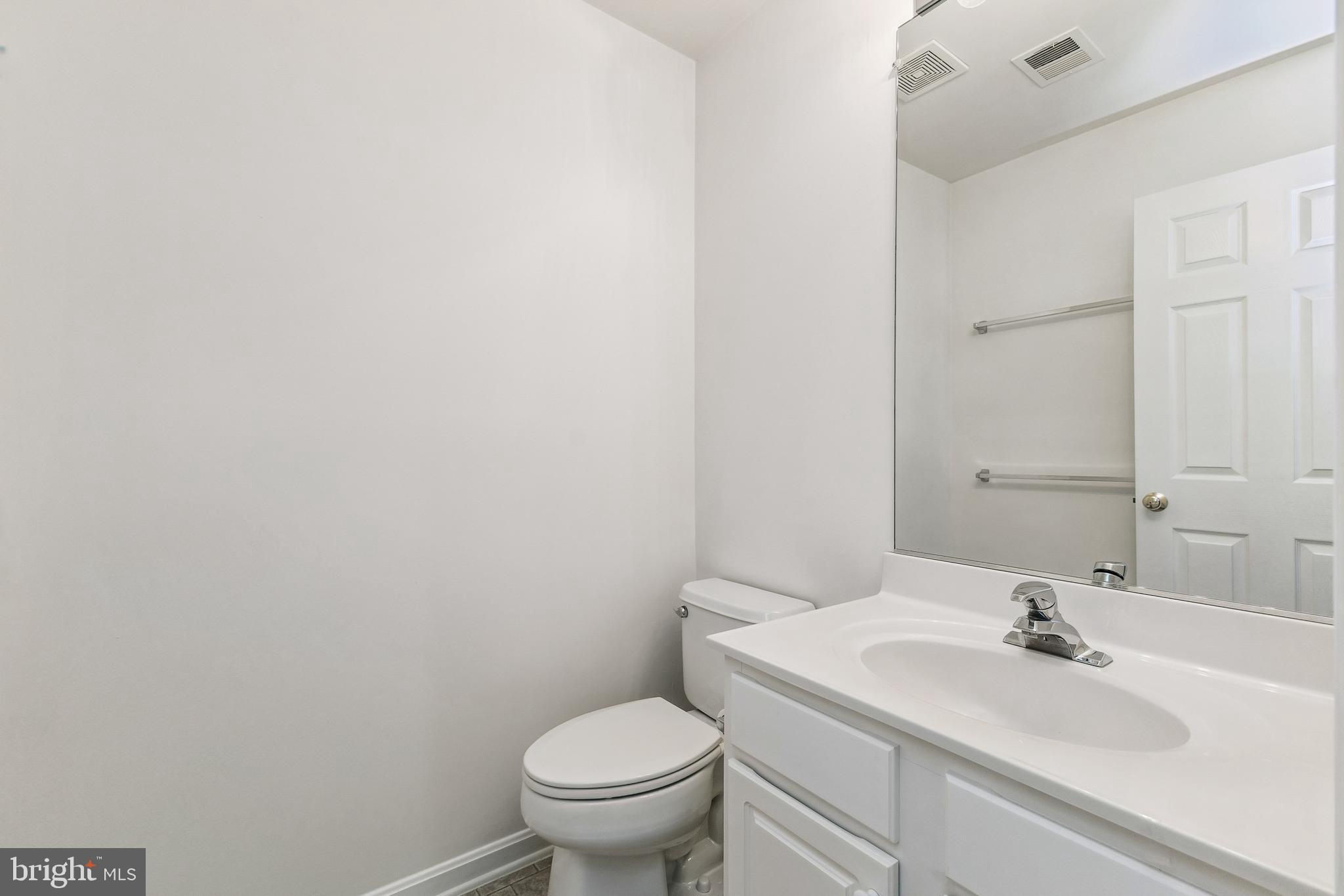 13083 Rose Petal Circle Herndon, VA 20171 - Photo 20 of 29 a bathroom with a sink and a toilet