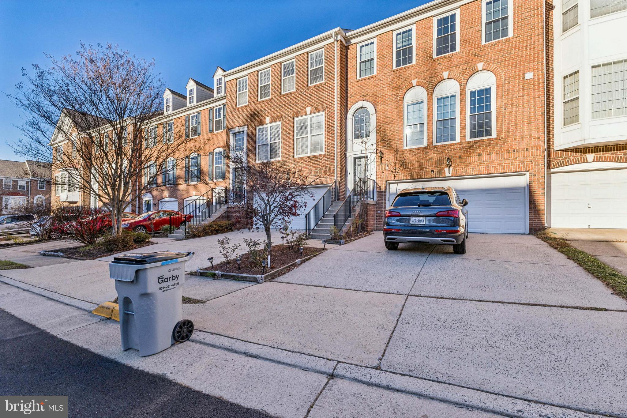 13083 Rose Petal Circle Herndon, VA 20171 - Photo 22 of 29 a car parked in front of a building