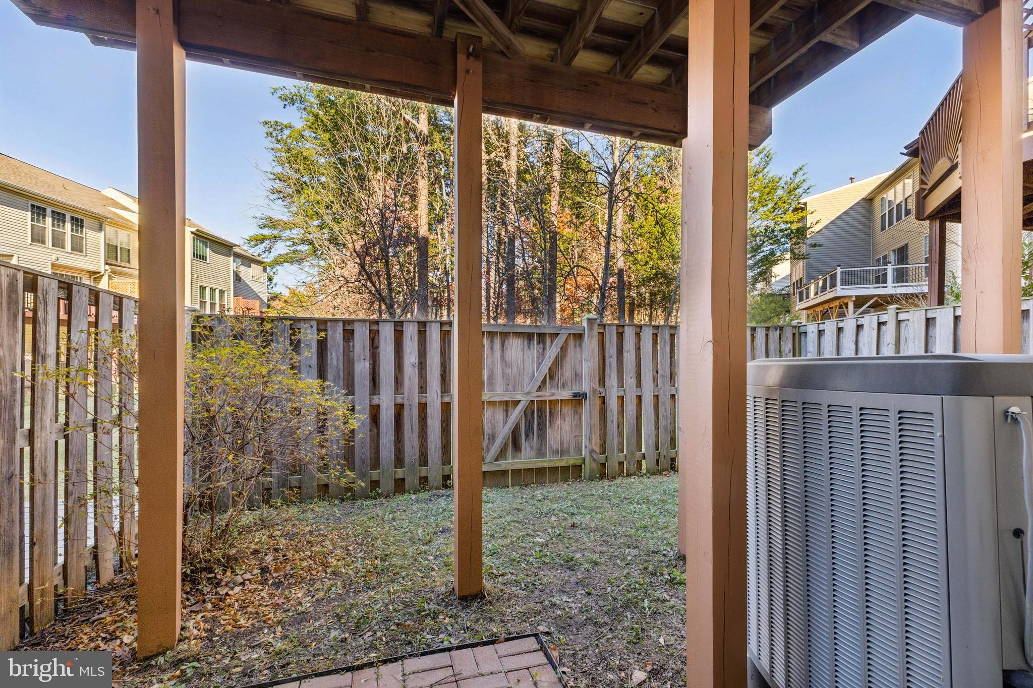 13083 Rose Petal Circle Herndon, VA 20171 - Photo 24 of 29 a view of a porch with a floor to ceiling window and tree