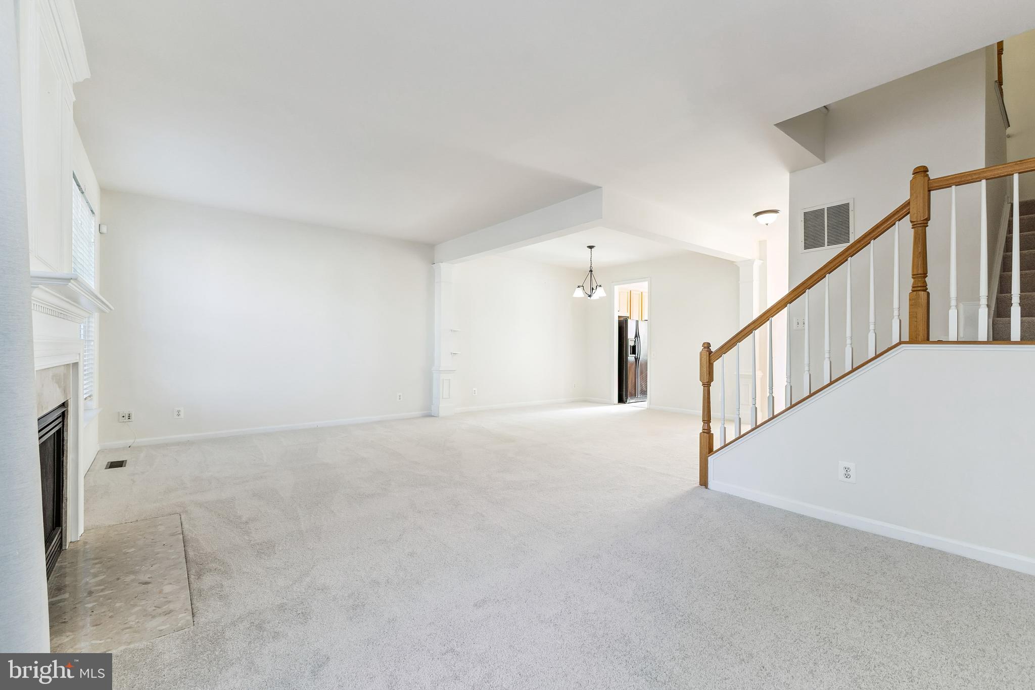 13083 Rose Petal Circle Herndon, VA 20171 - Photo 6 of 29 a view of an empty room with stairs