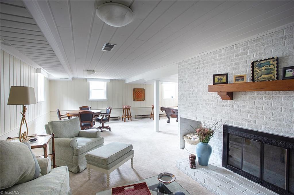 2741 Spring Garden Road Winston-Salem, NC 27106 - Photo 27 of 30 Lower level great room with wood-burning fireplace