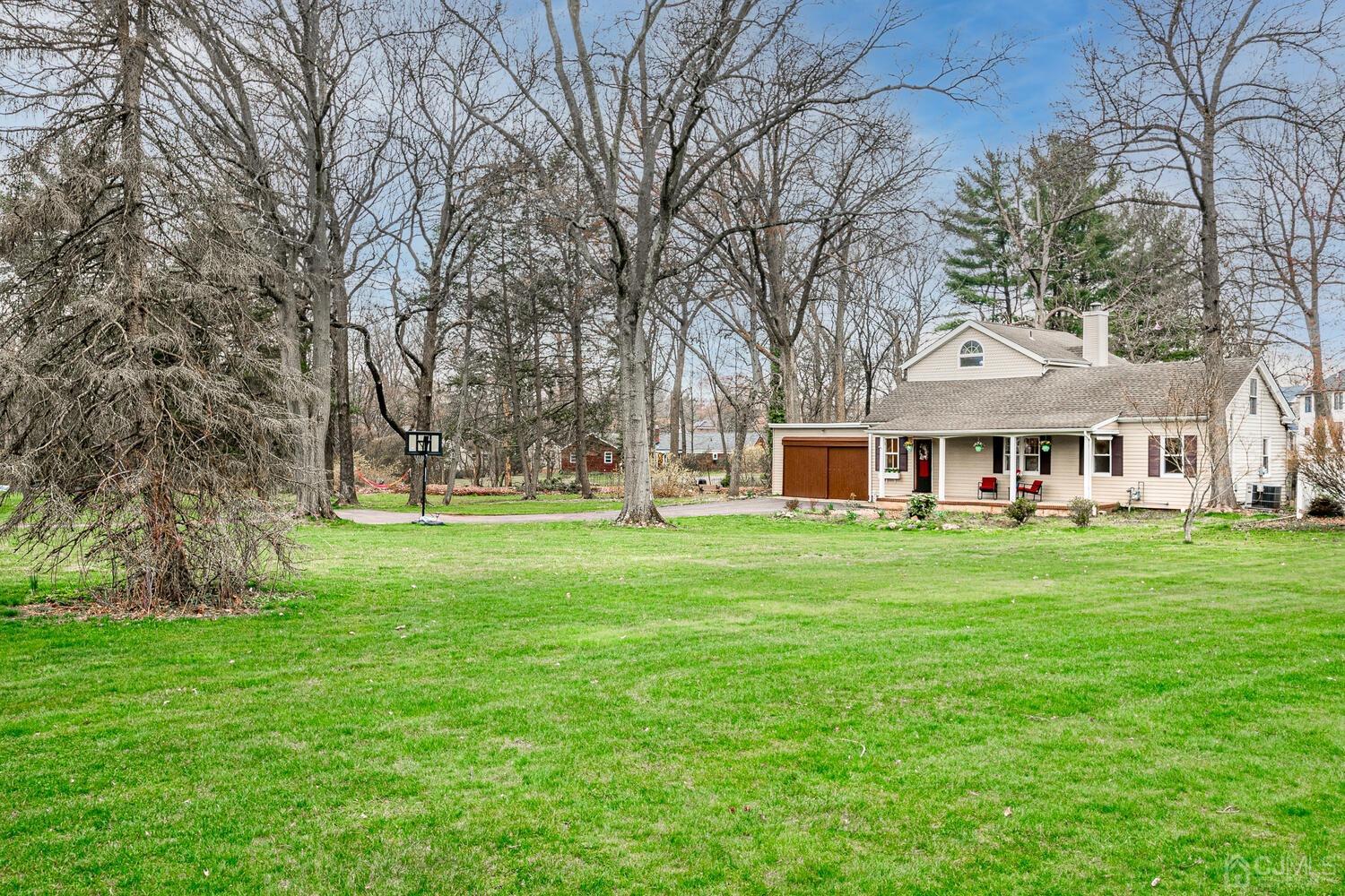 13 Herron Road Edison, NJ 08820 - Photo 1 of 51 a front view of a house with a garden