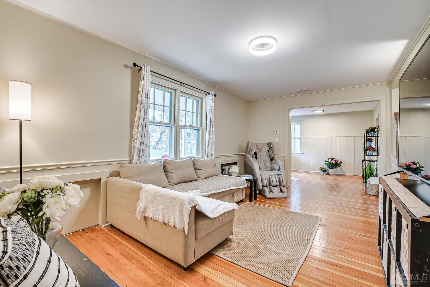 13 Herron Road Edison, NJ 08820 - Photo 20 of 51 a living room with furniture and wooden floor