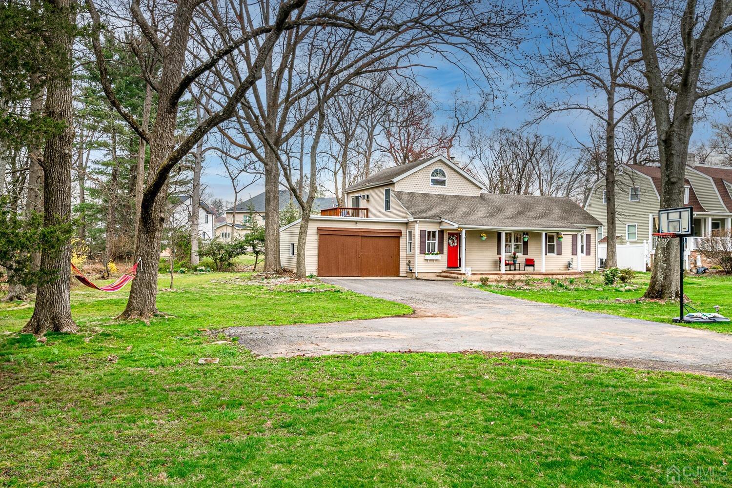 13 Herron Road Edison, NJ 08820 - Photo 2 of 51 a view of house with outdoor space and tree s