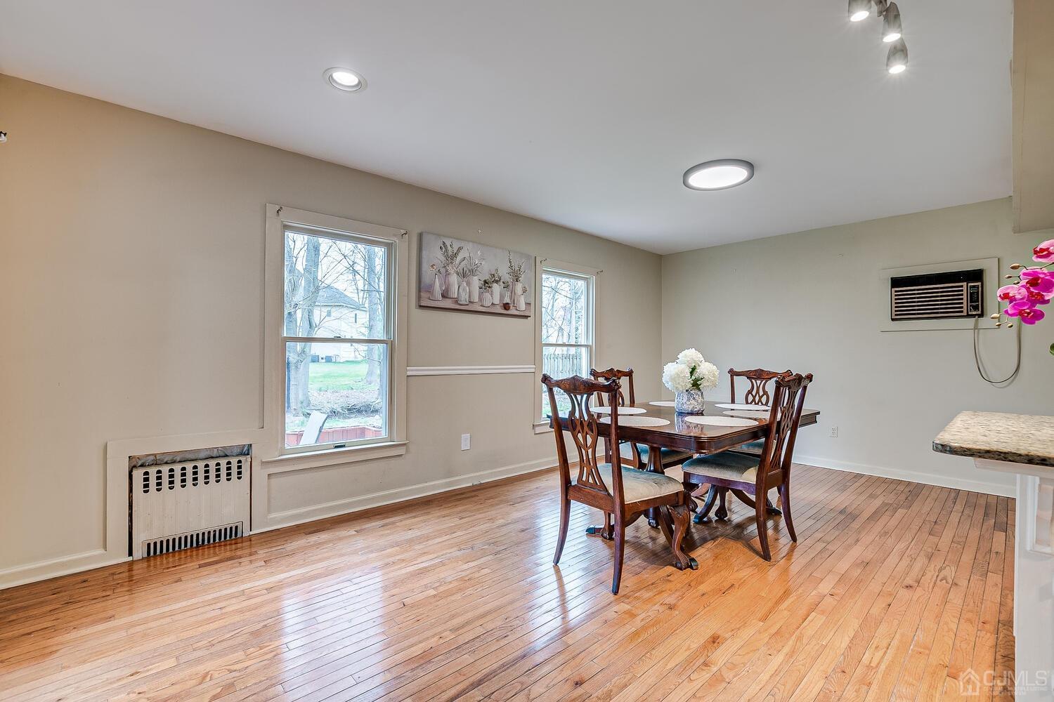 13 Herron Road Edison, NJ 08820 - Photo 26 of 51 a view of a dining room with furniture and wooden floor