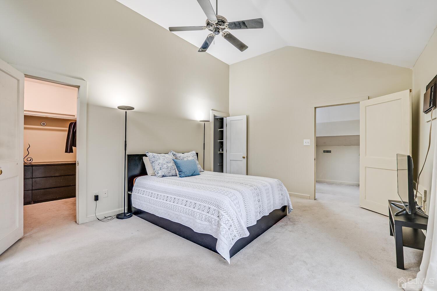 13 Herron Road Edison, NJ 08820 - Photo 39 of 51 a bedroom with a bed and a walk in closet