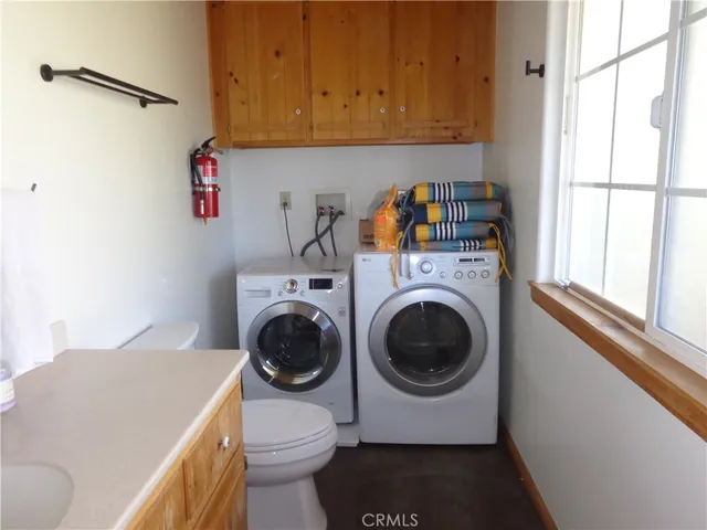 a kitchen with a refrigerator and a sink