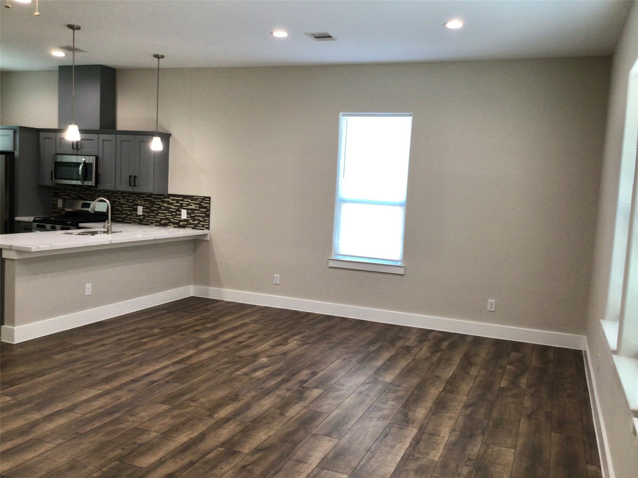 2109 Marnel Road, Unit F Houston, TX 77055 - Photo 13 of 29 a view of a kitchen with a sink and a window