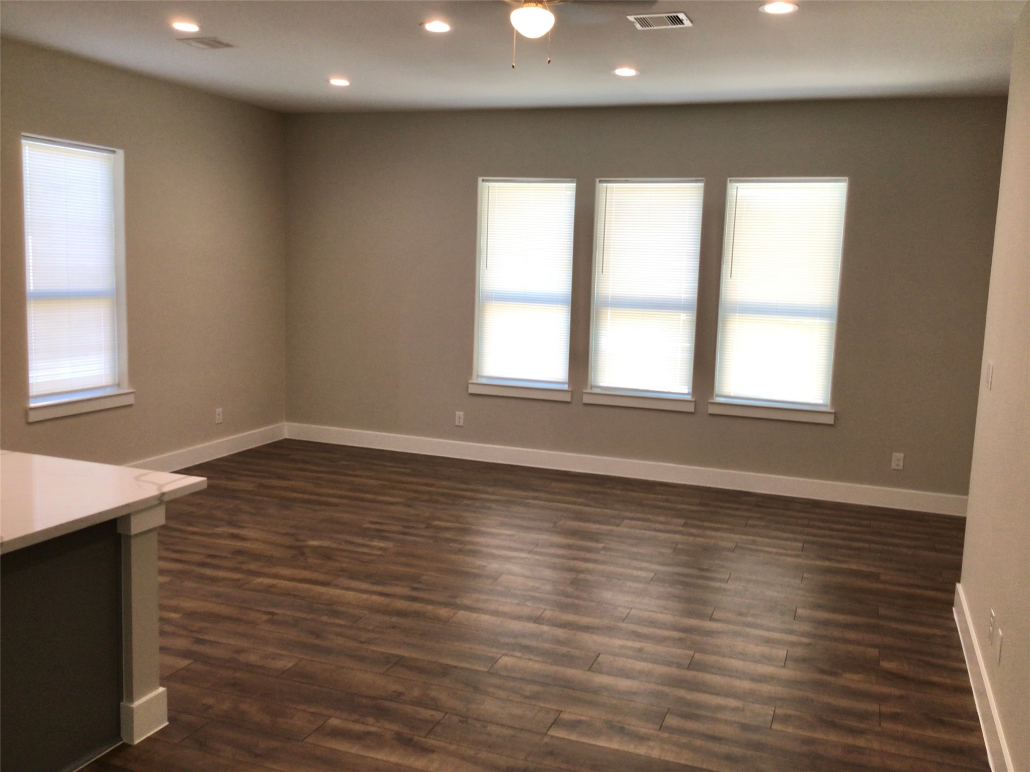 2109 Marnel Road, Unit F Houston, TX 77055 - Photo 15 of 29 an empty room with wooden floor and windows