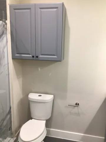 a bathroom with a toilet