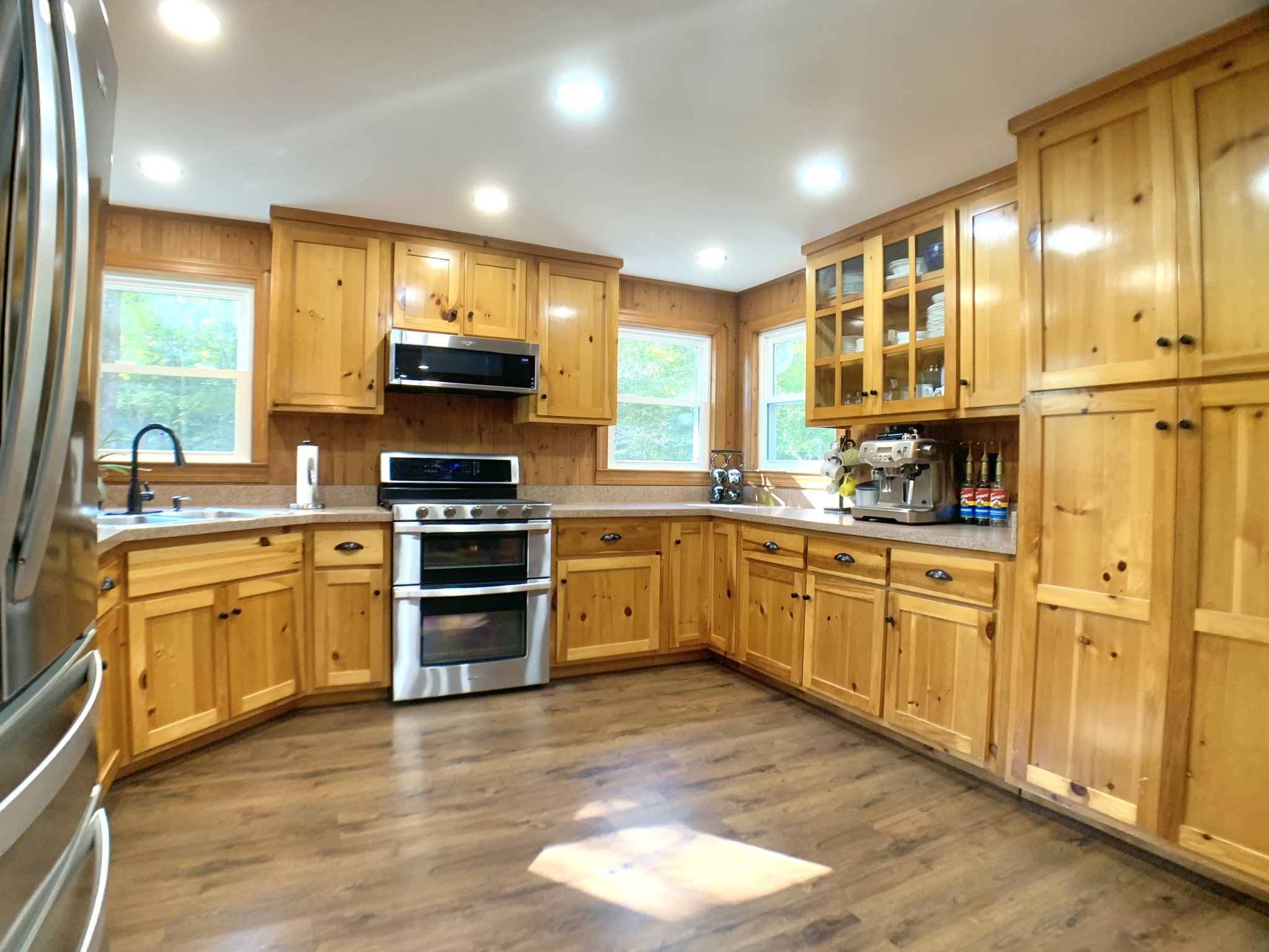 3979 Lem Davis Road Cunningham, TN 37052 - Photo 24 of 70 a kitchen with stainless steel appliances a stove sink and cabinets