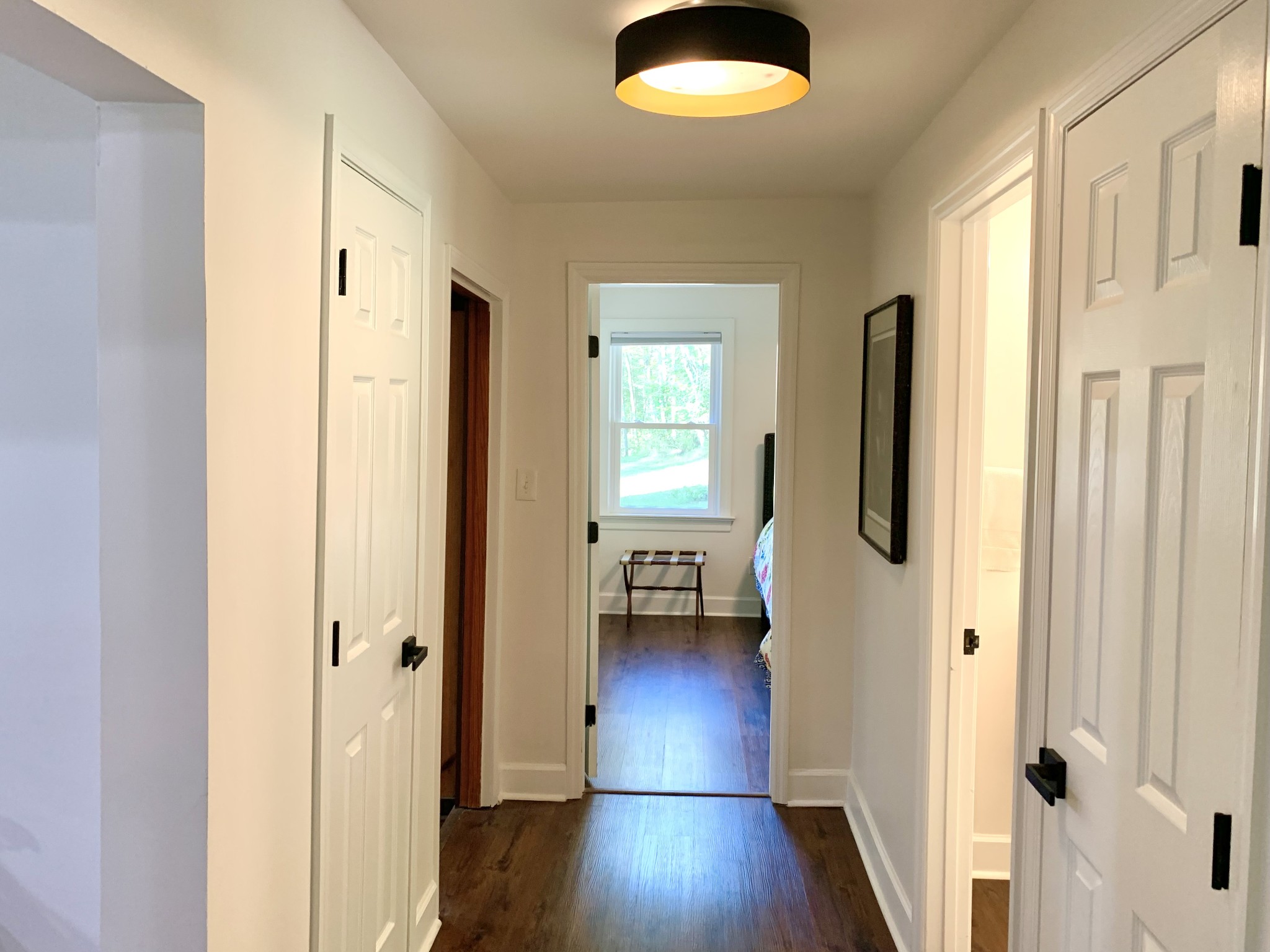 3979 Lem Davis Road Cunningham, TN 37052 - Photo 26 of 70 a view of a hallway with wooden floor and a livingroom view
