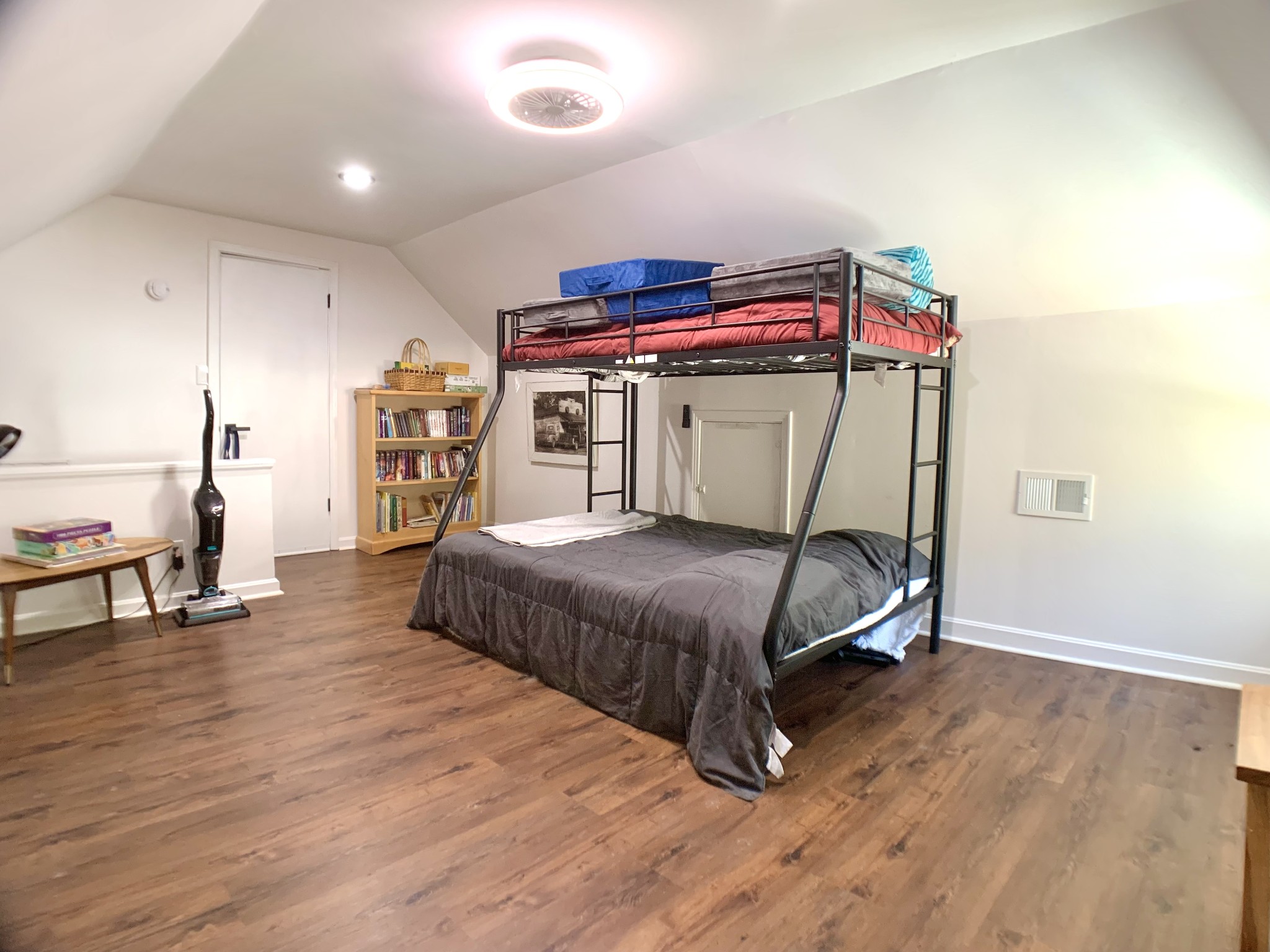 3979 Lem Davis Road Cunningham, TN 37052 - Photo 32 of 70 a bedroom with a bed and wooden floor