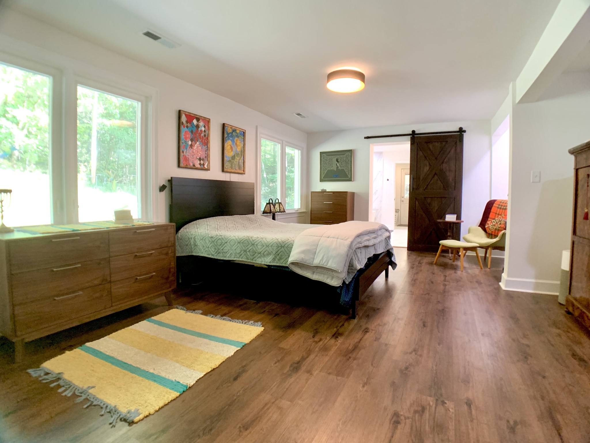 3979 Lem Davis Road Cunningham, TN 37052 - Photo 33 of 70 a bedroom with a bed and wooden floor