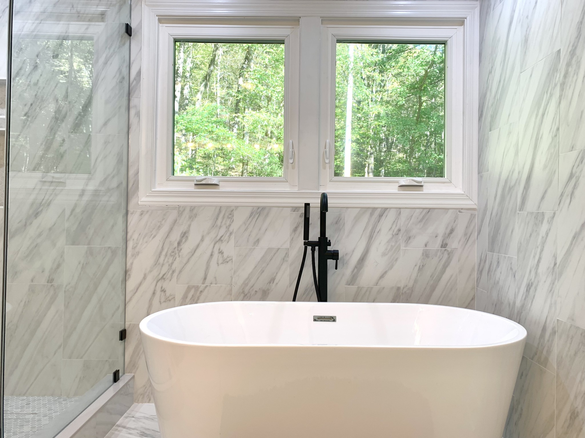 3979 Lem Davis Road Cunningham, TN 37052 - Photo 39 of 70 a white bath tub sitting in a bathroom next to a window