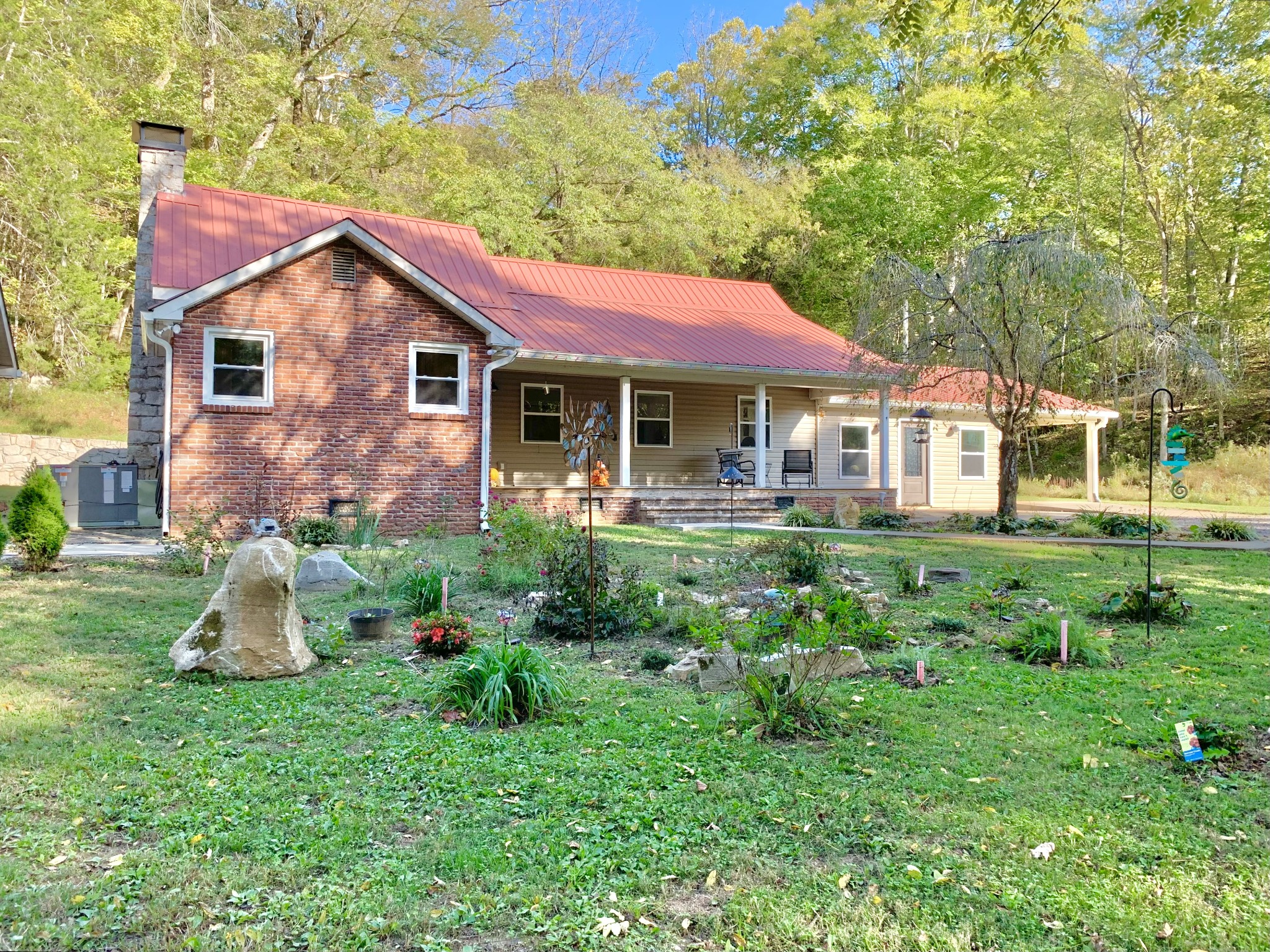 3979 Lem Davis Road Cunningham, TN 37052 - Photo 4 of 70 a front view of a house with garden