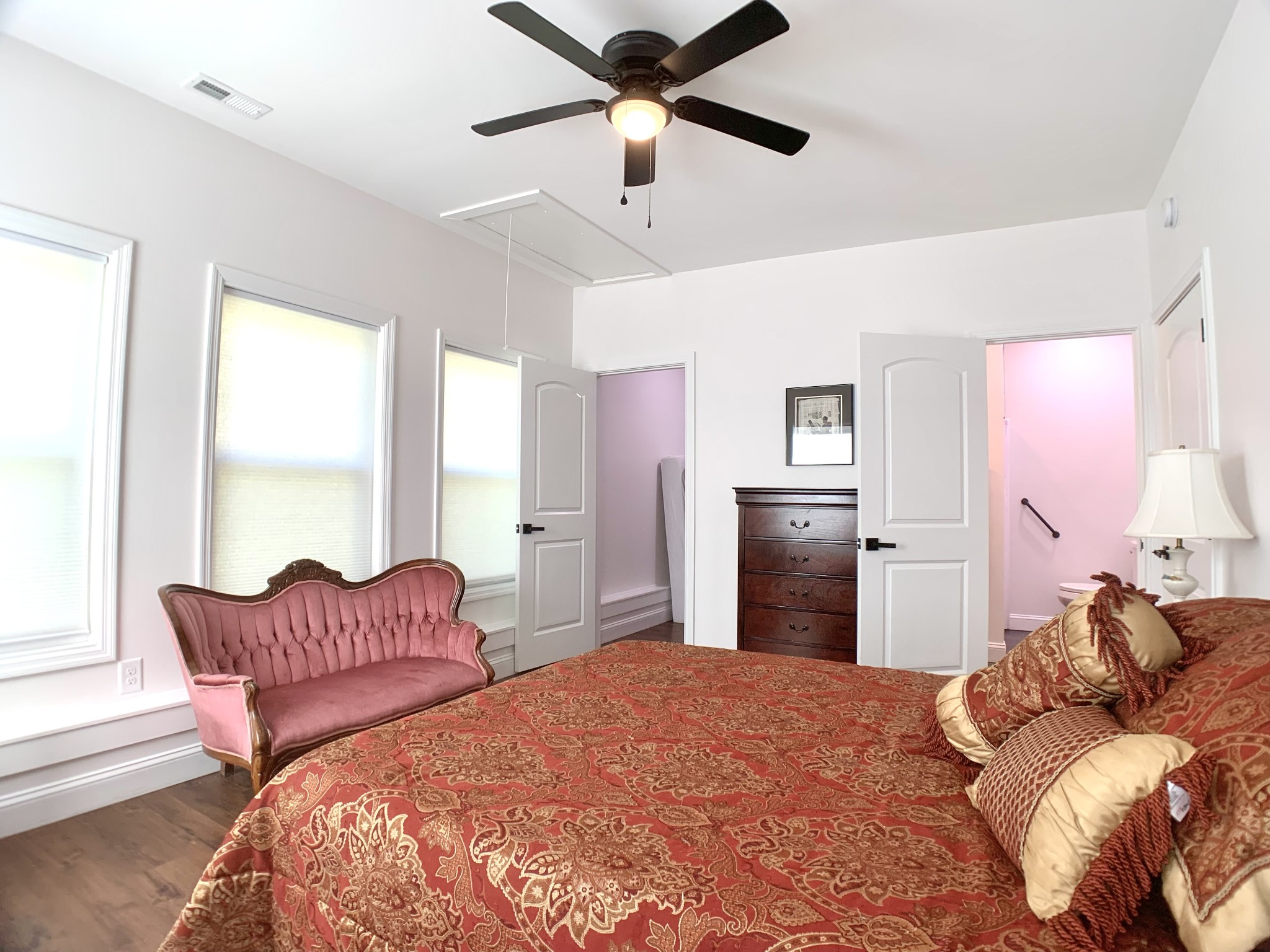 3979 Lem Davis Road Cunningham, TN 37052 - Photo 60 of 70 a bedroom with a large bed and a chandelier