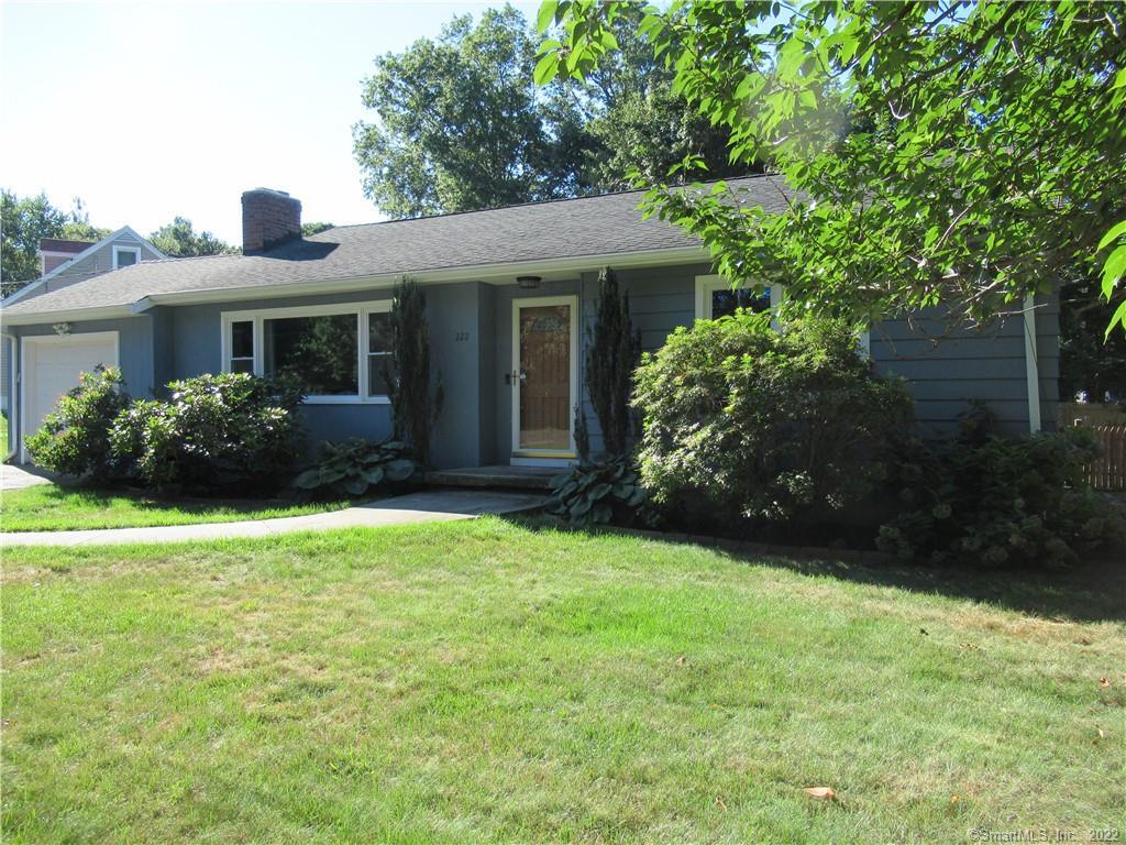 222 Plains Road Milford, CT 06461 - Photo 1 of 1 a front view of a house with garden