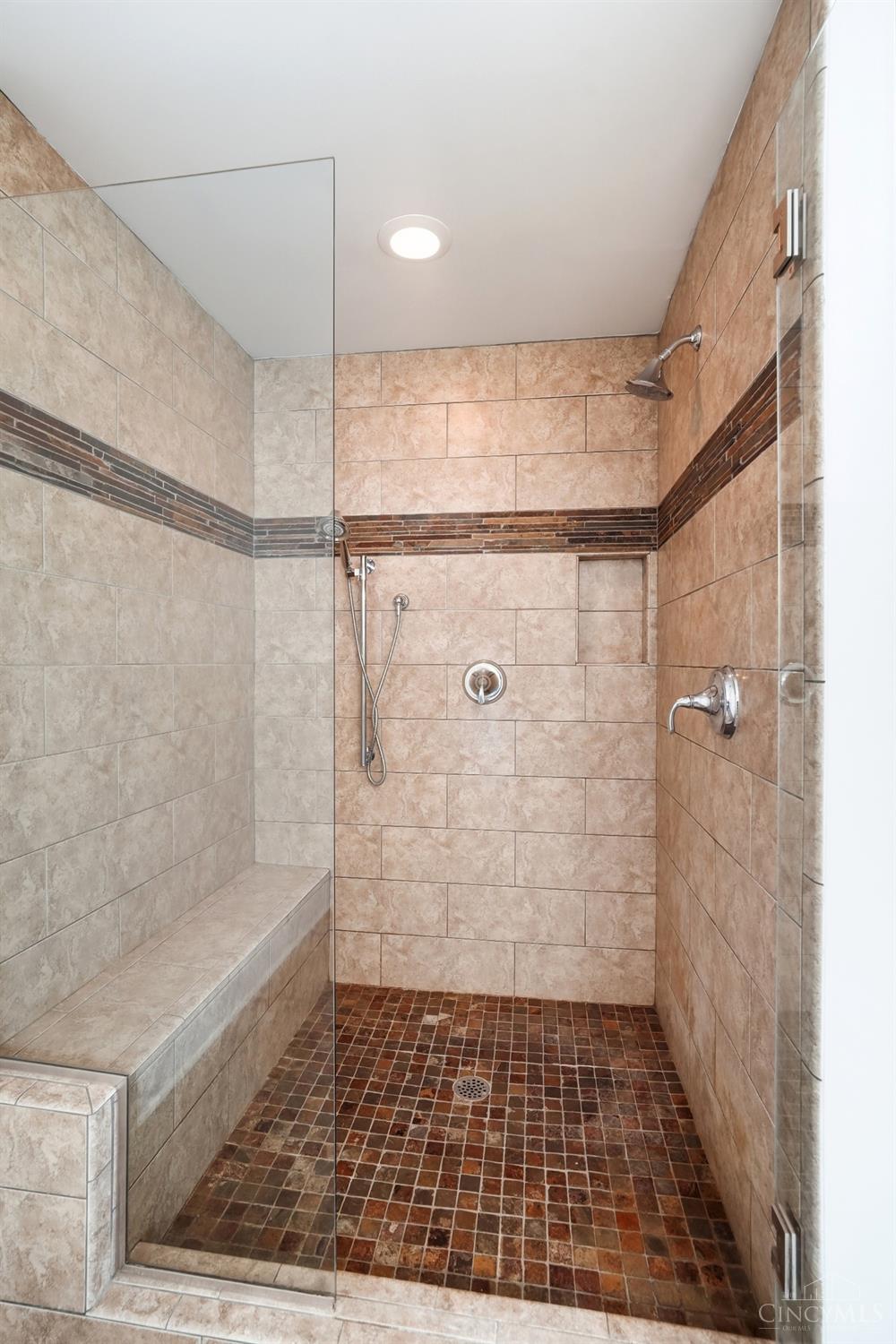 3003 Riverside Drive Cincinnati, OH 45226 - Photo 27 of 65 Spacious walk-in shower with multi shower heads and a built-in bench.