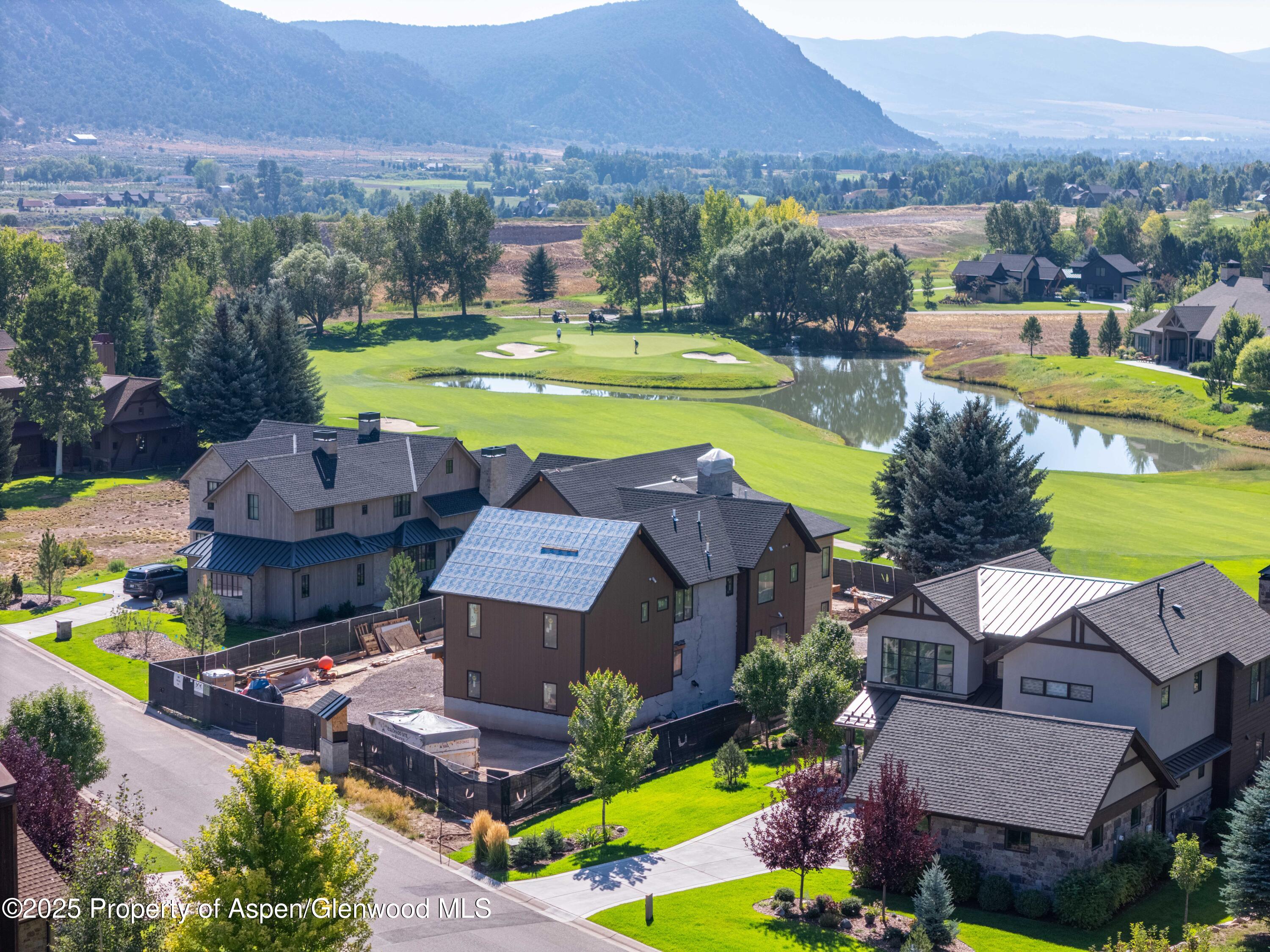 589 Saddleback Road Carbondale, CO 81623 - Photo 3 of 23 an aerial view of a house with a swimming pool outdoor seating and yard