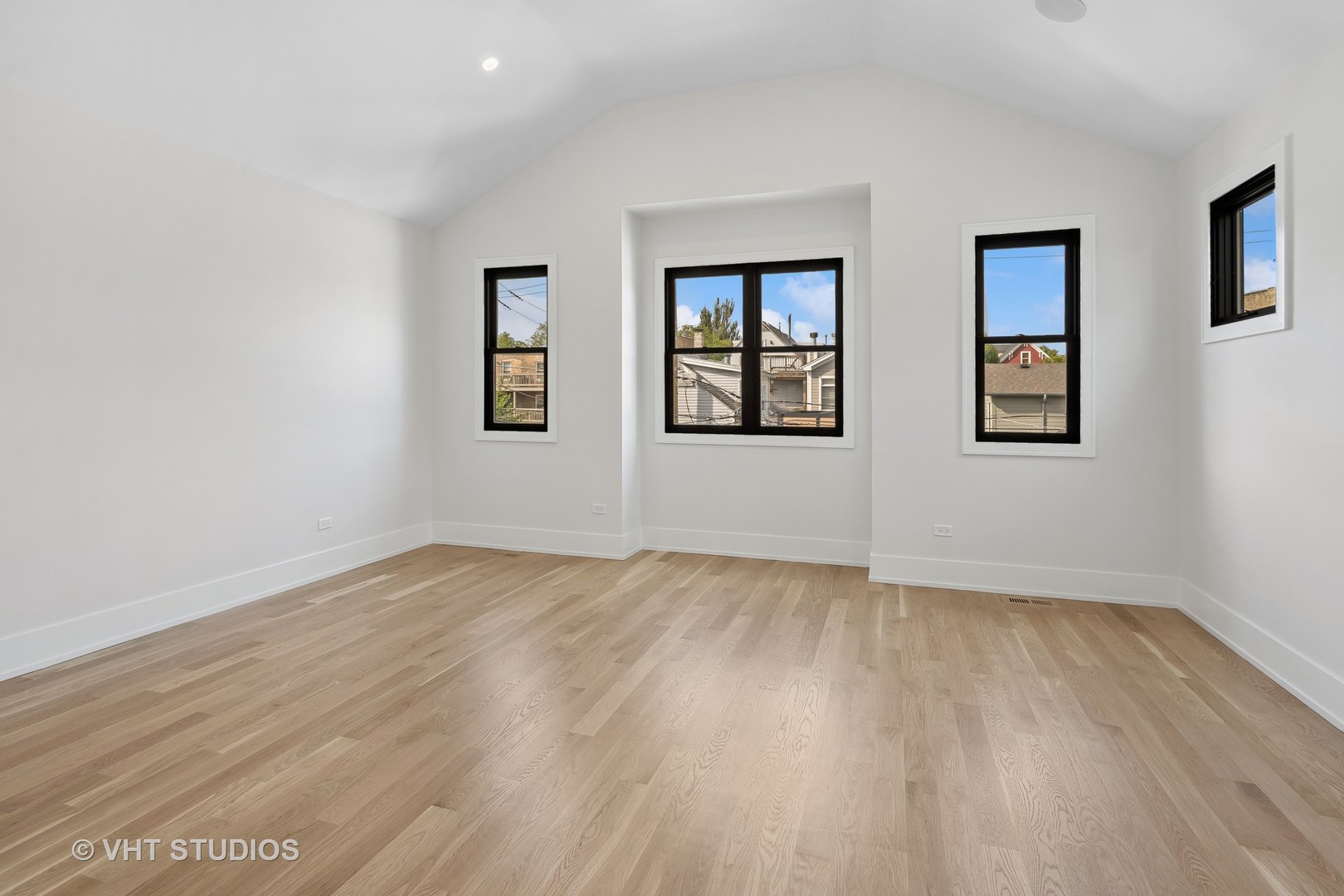 3018 North Seminary Avenue Chicago, IL 60657 - Photo 11 of 62 a view of an empty room with wooden floor and a window