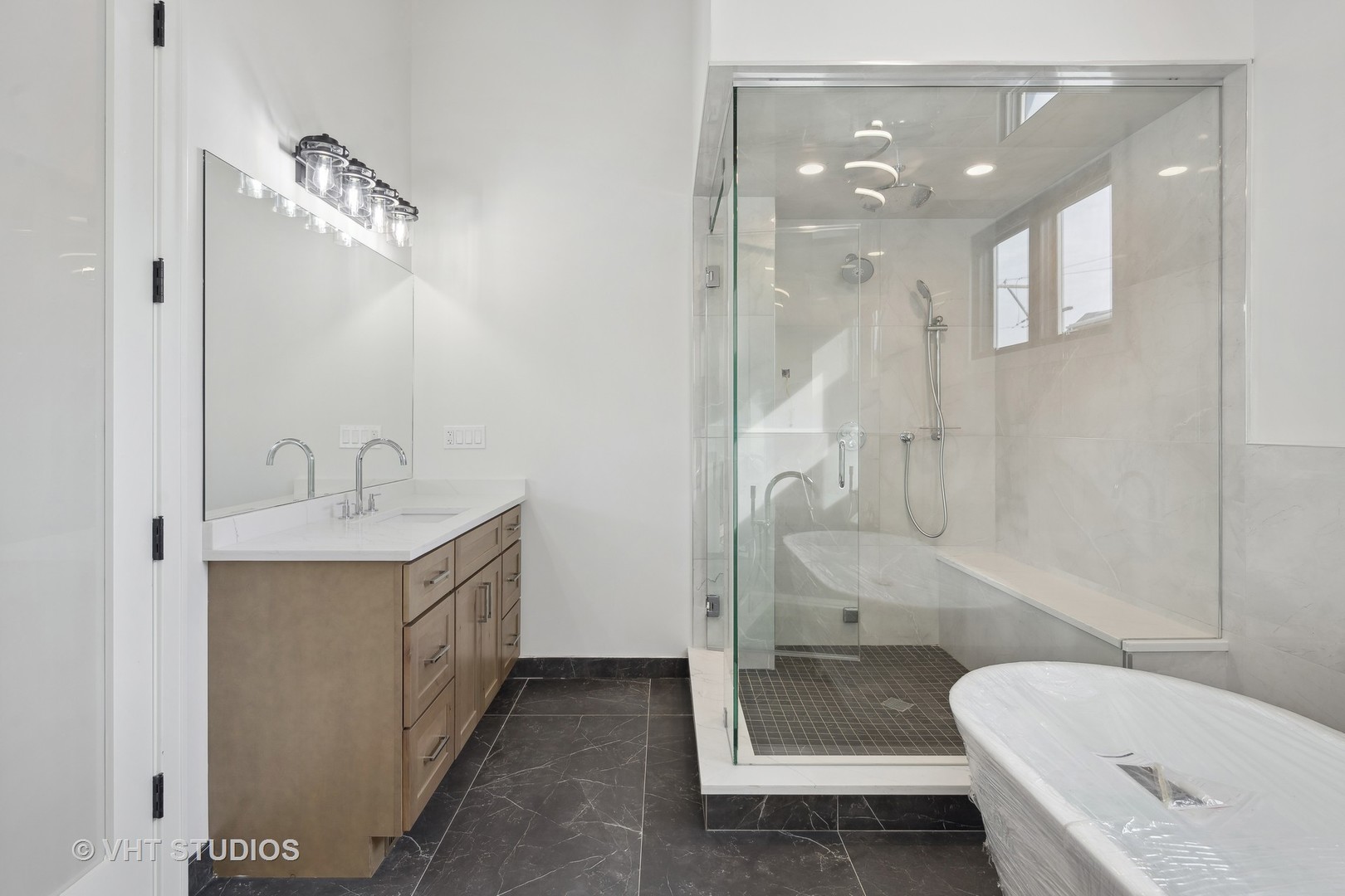 3018 North Seminary Avenue Chicago, IL 60657 - Photo 13 of 62 a bathroom with a sink a toilet and shower