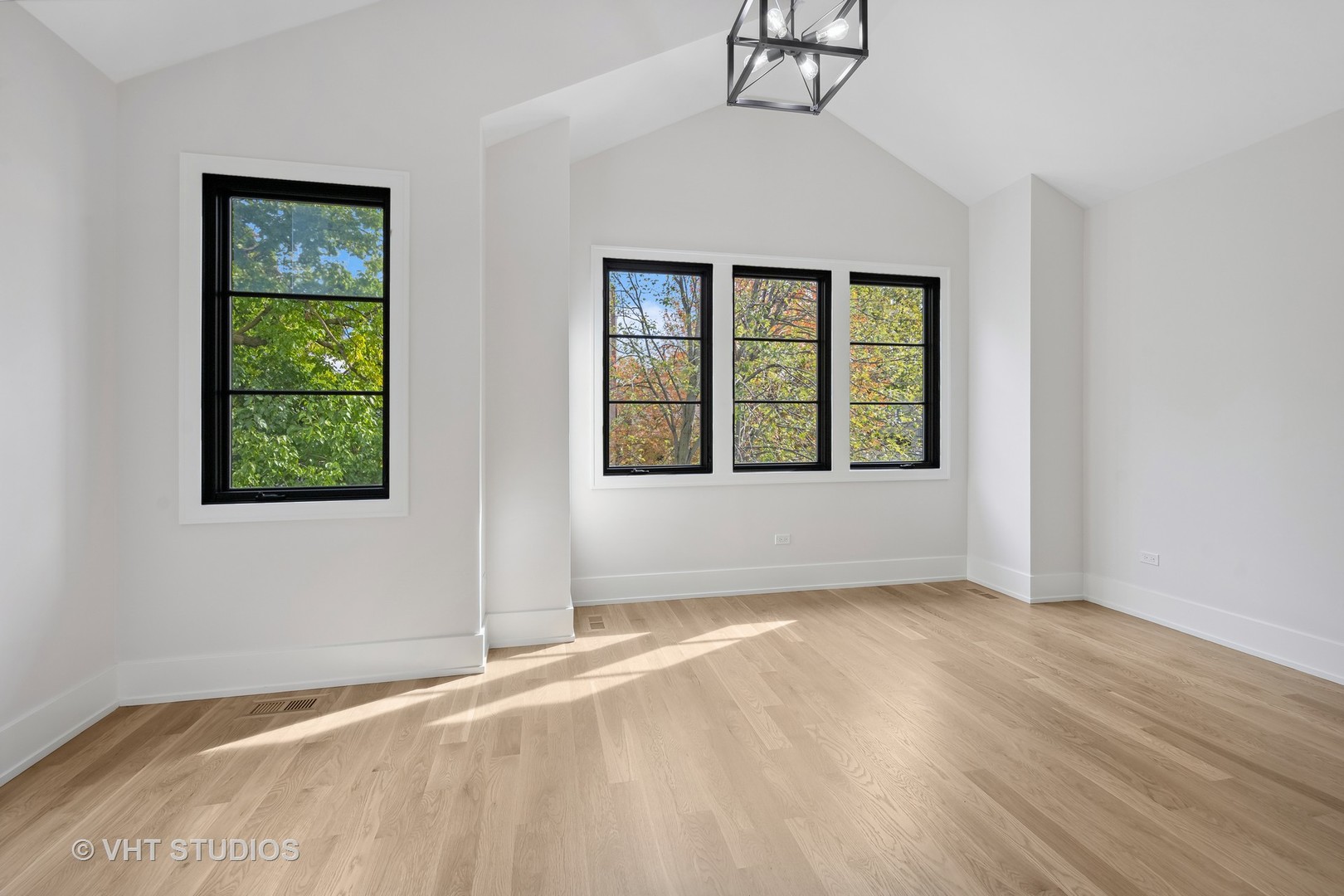 3018 North Seminary Avenue Chicago, IL 60657 - Photo 14 of 62 a view of an empty room with wooden floor and a window
