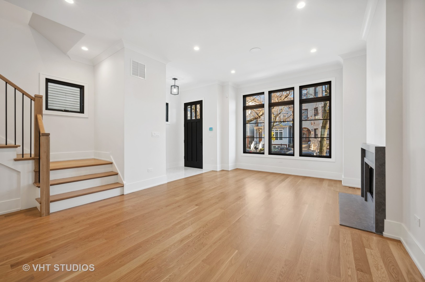 3018 North Seminary Avenue Chicago, IL 60657 - Photo 21 of 62 a view of an empty room with wooden floor and a window
