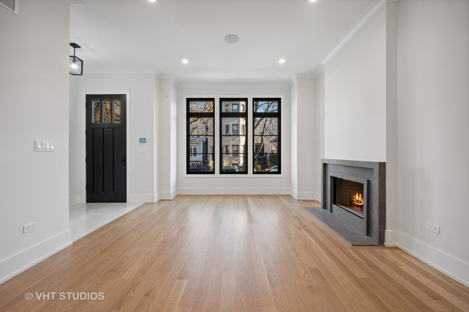 3018 North Seminary Avenue Chicago, IL 60657 - Photo 22 of 62 an empty room with wooden floor fireplace and windows