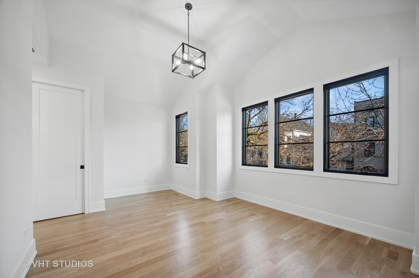 3018 North Seminary Avenue Chicago, IL 60657 - Photo 26 of 62 a view of an empty room with a window and wooden floor