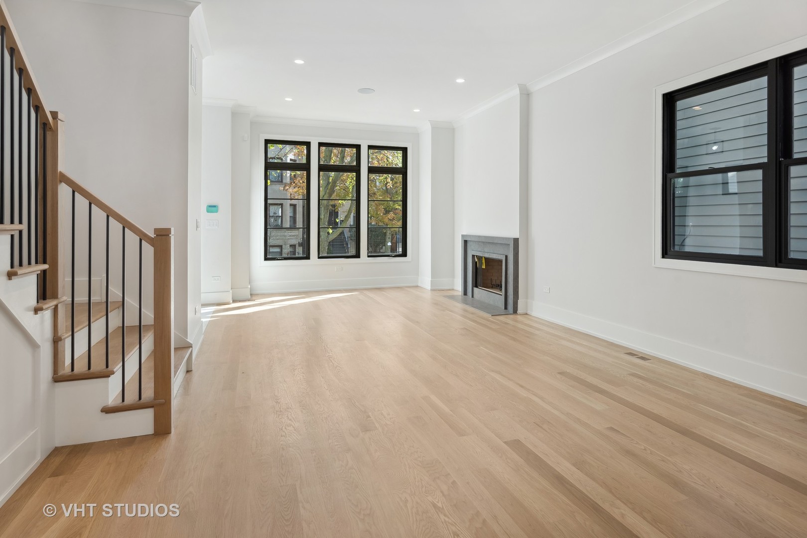 3018 North Seminary Avenue Chicago, IL 60657 - Photo 3 of 62 a view of an empty room with a window and wooden floor