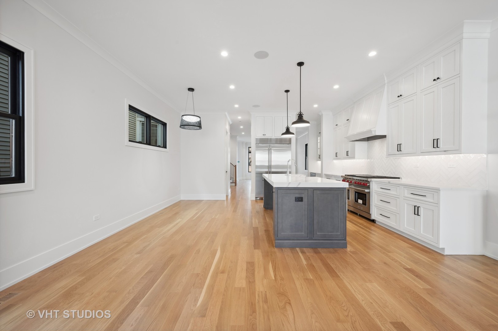 3018 North Seminary Avenue Chicago, IL 60657 - Photo 39 of 62 a room with kitchen island a sink wooden floor and view living room