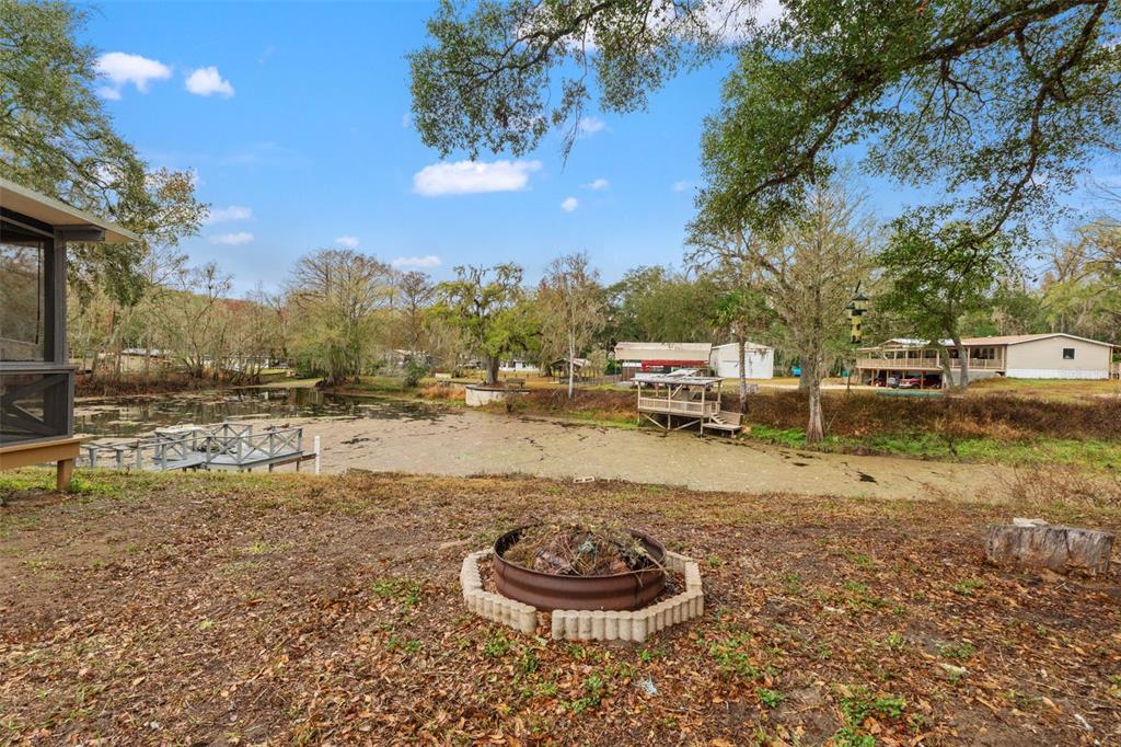 7154 County Road 651 Bushnell, FL 33513 - Photo 22 of 34 a view of a lake with houses