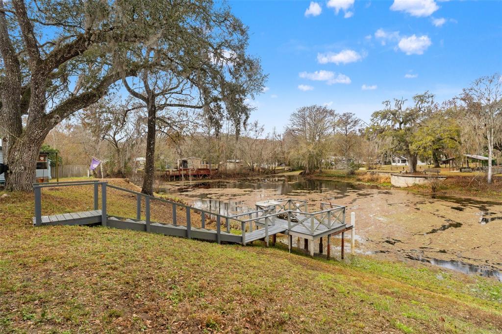 7154 County Road 651 Bushnell, FL 33513 - Photo 26 of 34 a view of a lake with houses
