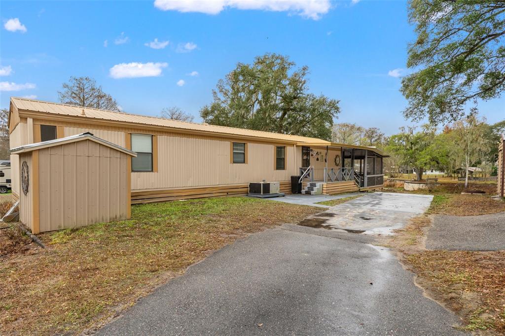 7154 County Road 651 Bushnell, FL 33513 - Photo 3 of 34 a view of a house with a backyard