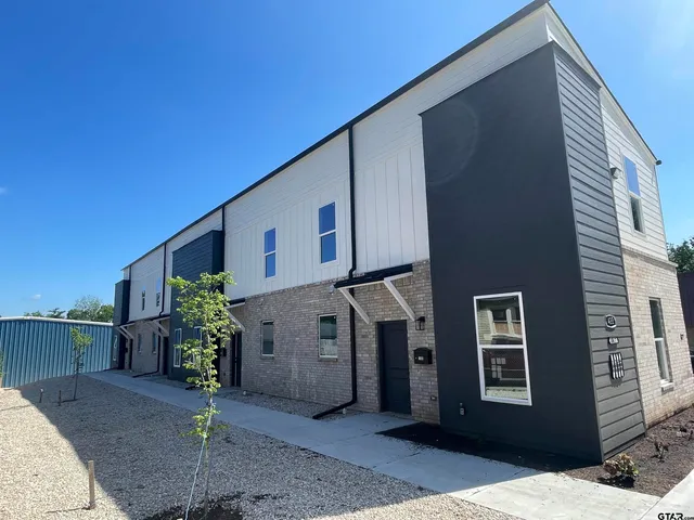 a house view with a backyard space