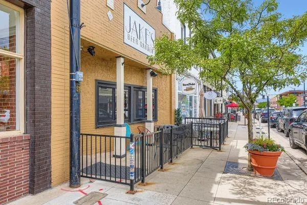 a view of a building with a potted plant and a window